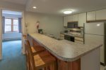 Kitchen with Breakfast Bar at Deer Park Condo